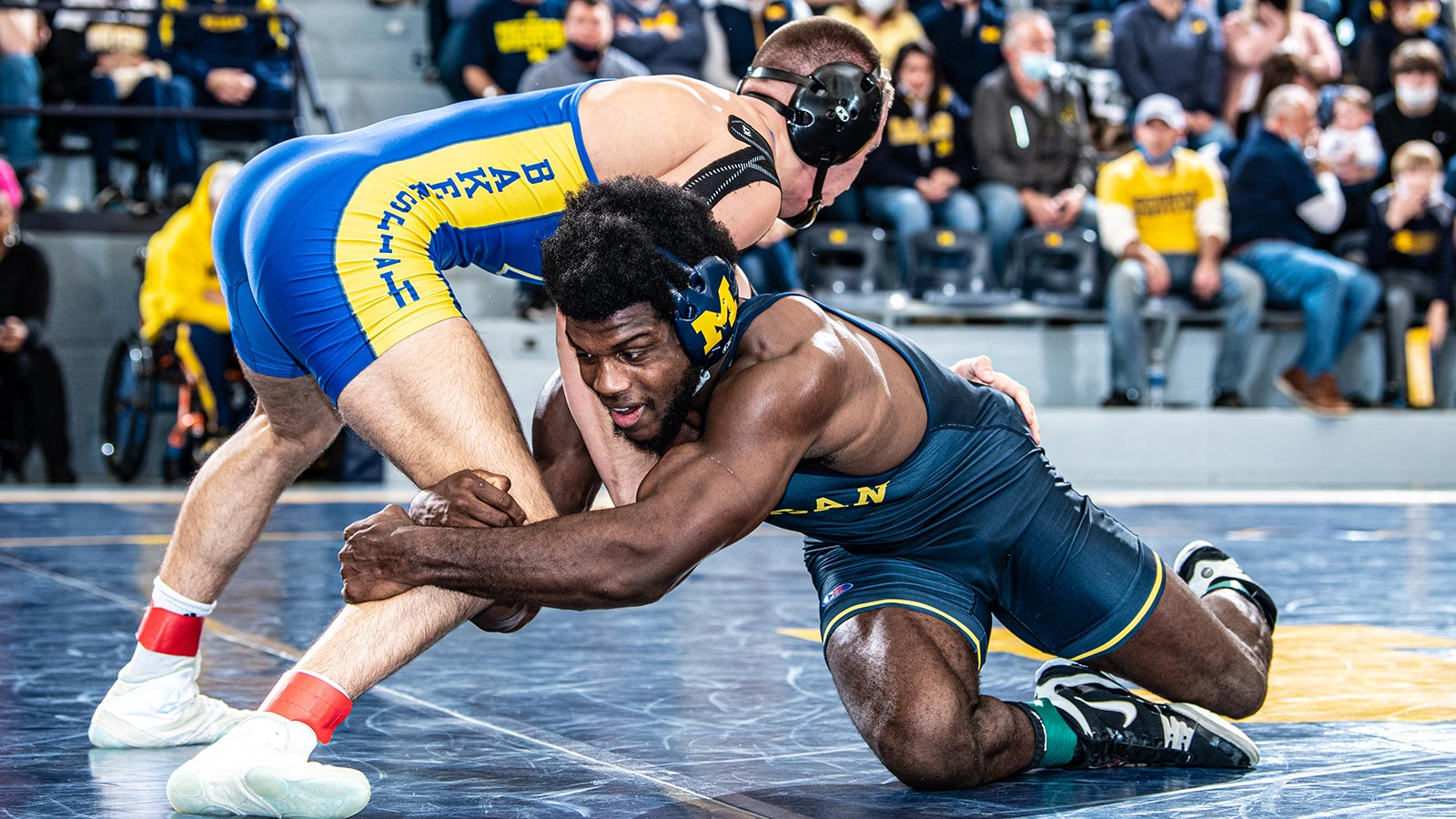 Collegiate wrestler finishing a low single